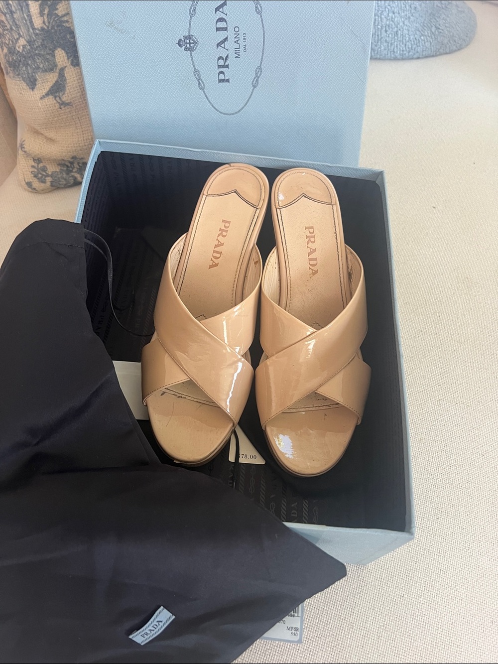 Prada Patent Leather Crisscross Slide Mules in Nude
